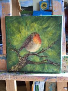 Robin with leafy background