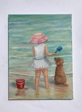 Load image into Gallery viewer, Girl and dog with red bucket on the shore